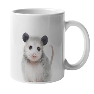 White mug wit an image of an opossum
